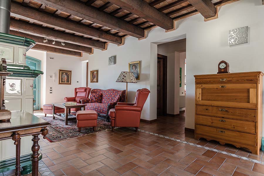 Living room with fireplace and exposed wooden beams