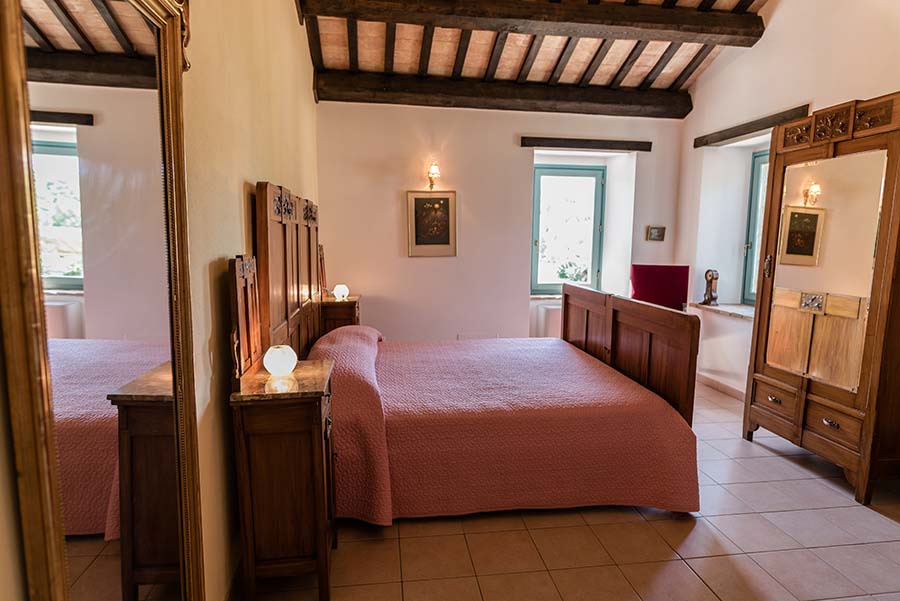 Master double bedroom with traditional wooden furniture