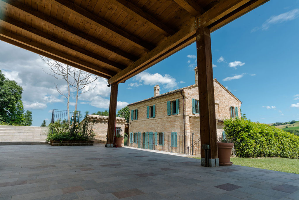 Shaded pergola facing the Casale Vigneto stone villa